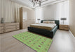 Patterned Olive Green Rug in a Bedroom, pat3083lblu