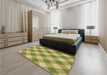 Patterned Dark Yellow Green Rug in a Bedroom, pat3151brn