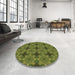 Round Patterned Dark Yellow Green Rug in a Office, pat3210brn