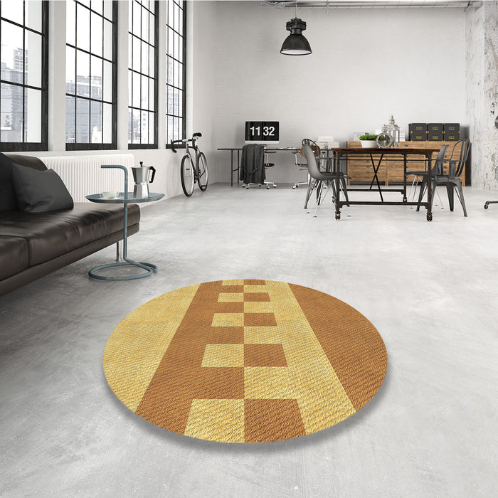 Round Patterned Saffron Yellow Rug in a Office, pat3950brn