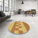 Round Patterned Saffron Yellow Rug in a Office, pat3950brn