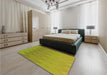 Patterned Dark Yellow Green Rug in a Bedroom, pat3983org