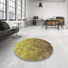 Round Patterned Yellow Rug in a Office, pat425brn