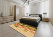 Patterned Yellow Orange Rug in a Bedroom, pat442org