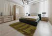 Patterned Dark Yellow Green Rug in a Bedroom, pat560org