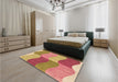 Patterned Yellow Orange Rug in a Bedroom, pat966org