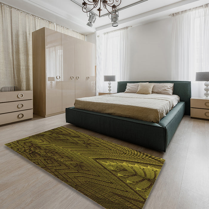 Patterned Dark Yellow Green Rug in a Bedroom, pat972org