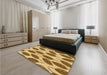 Patterned Yellow Orange Rug in a Bedroom, pat993org